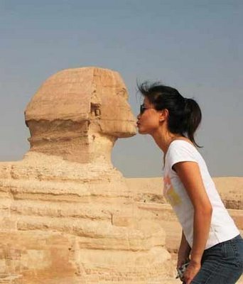 Woman kissing sphynx Woman kissing sphynx